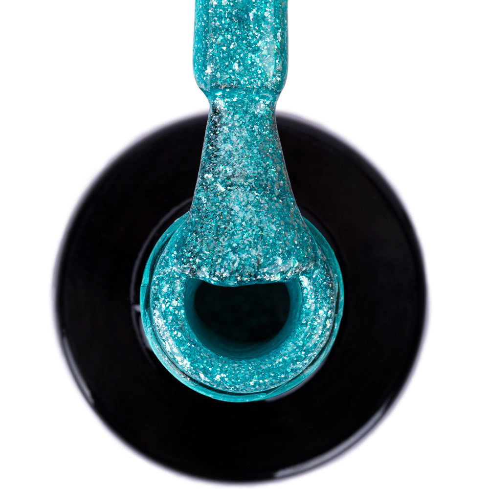 NTN Premium 502 turkoosi glitter värigeelilakka pullossa, kimaltava pinta