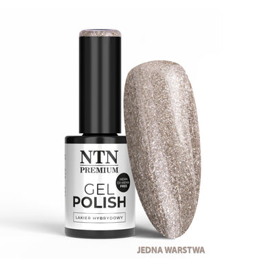 NTN Premium geelilakka 5 g sävy 209, mustavalkoinen pullo ja vaalea samppanjanvärinen glitterkynsimalli.