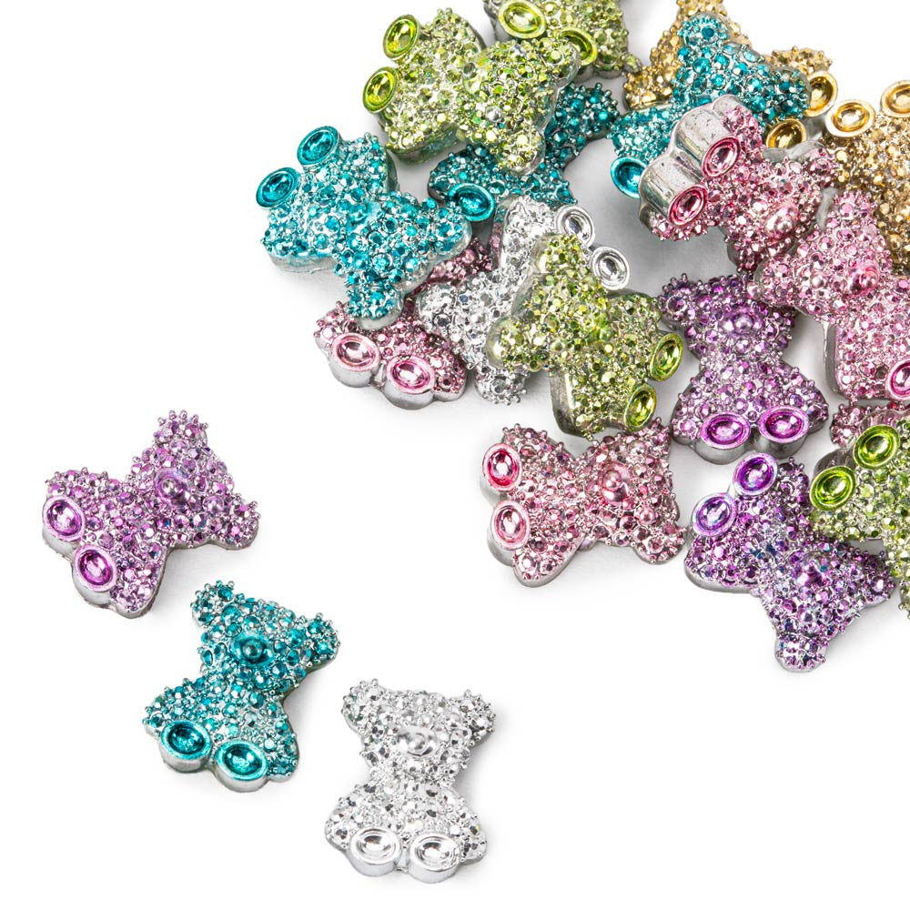 Lähikuva Molly Nails 3D-nallekoristeista eri väreissä, kimaltelevat kynsikoristeet